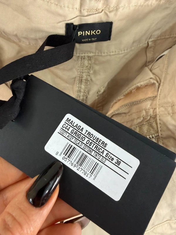 Pinko swing tag on beige cargo trousers
