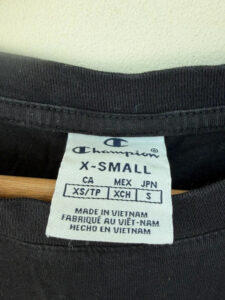 Label on a Champion piece, UK 6, Y2K