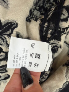 Emanuel Ungaro care label: do not wash, do not tumble dry, do not bleach, iron low