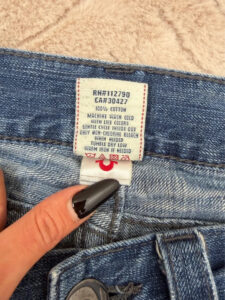 True Religion care label: machine wash, tumble dry low, iron low, wash inside out, wash with similar colours