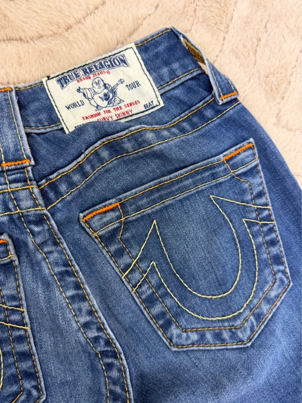 True Religion tag and horseshoe pocket stitching