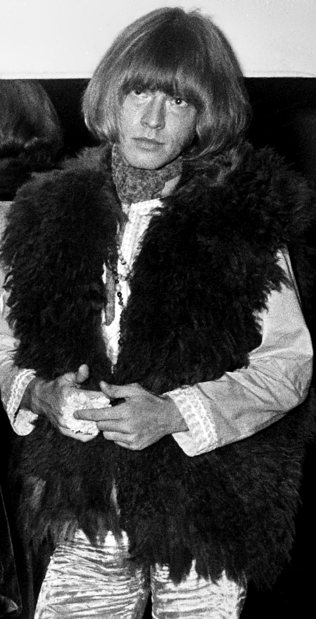 Brian Jones of the Rolling Stones in 1967 wearing a shaggy dark sheepskin waistcoat over an embroidered shirt