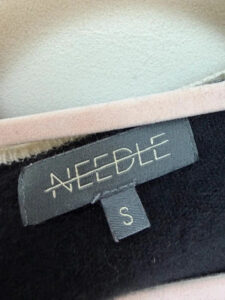 Label on a Needles piece, UK 8
