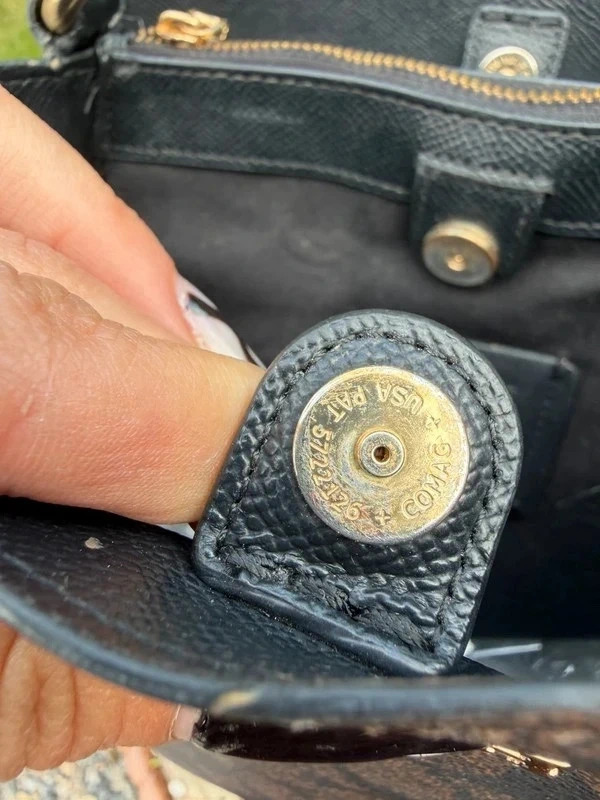 Engraved Coach snap inside the bag