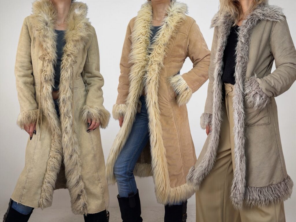 Three long Penny Lane coats worn open, in beige and taupe suede with long shaggy fur along the front, cuffs and hem